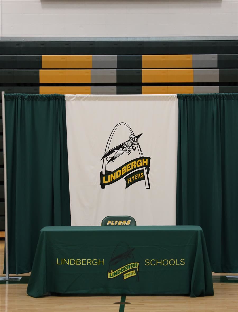  Signing Day table and chair with Lindbergh arch and plane logo